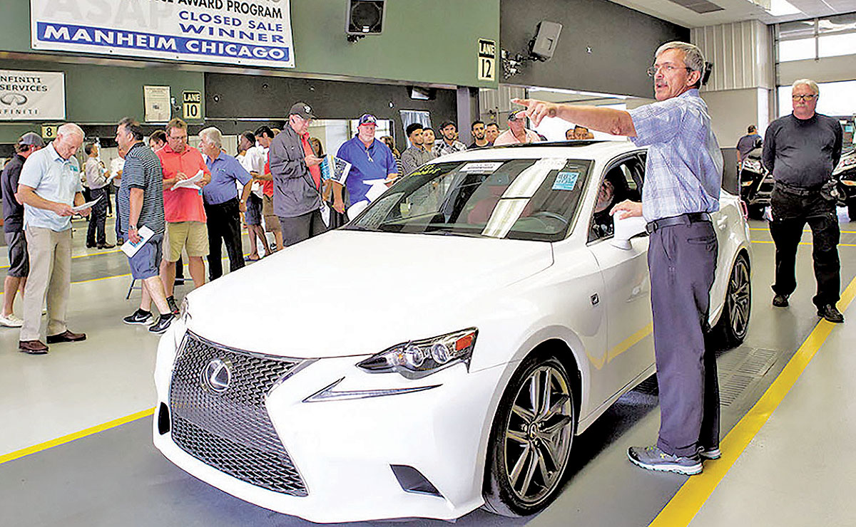 A car is auctioned at Manheim's Chicago site. Auctions are scrambling to meet clients' demands for more data and analysis.